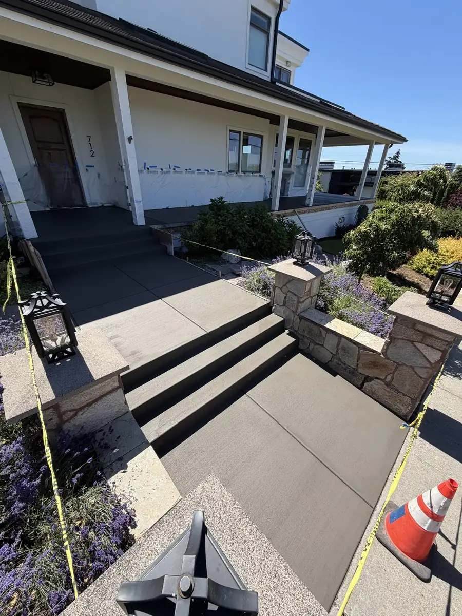 Broom-finished concrete entry steps and walkway at a home in Olympia, WA