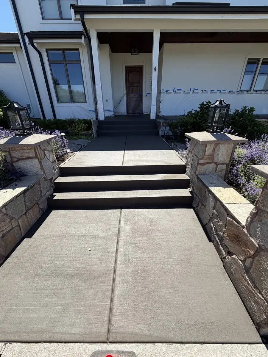 New concrete front steps and walkway to a porch at a home in Olympia, WA