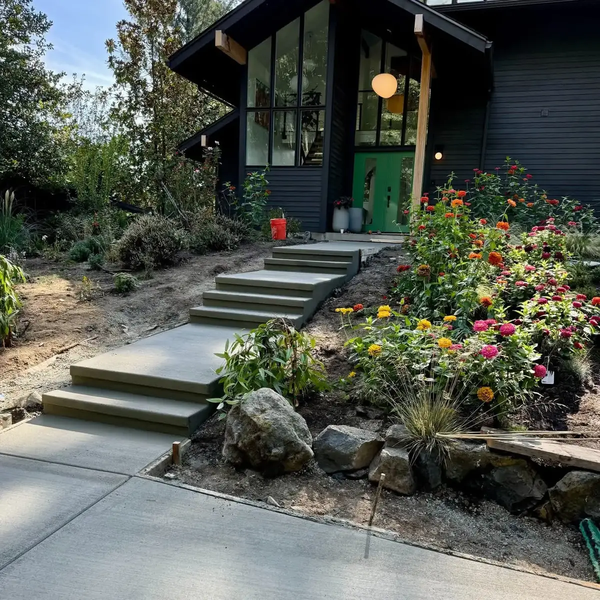 Concrete garden steps and walkway leading to a modern home in Thurston County, WA